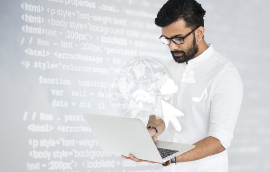 Indian software engineer working on his laptop